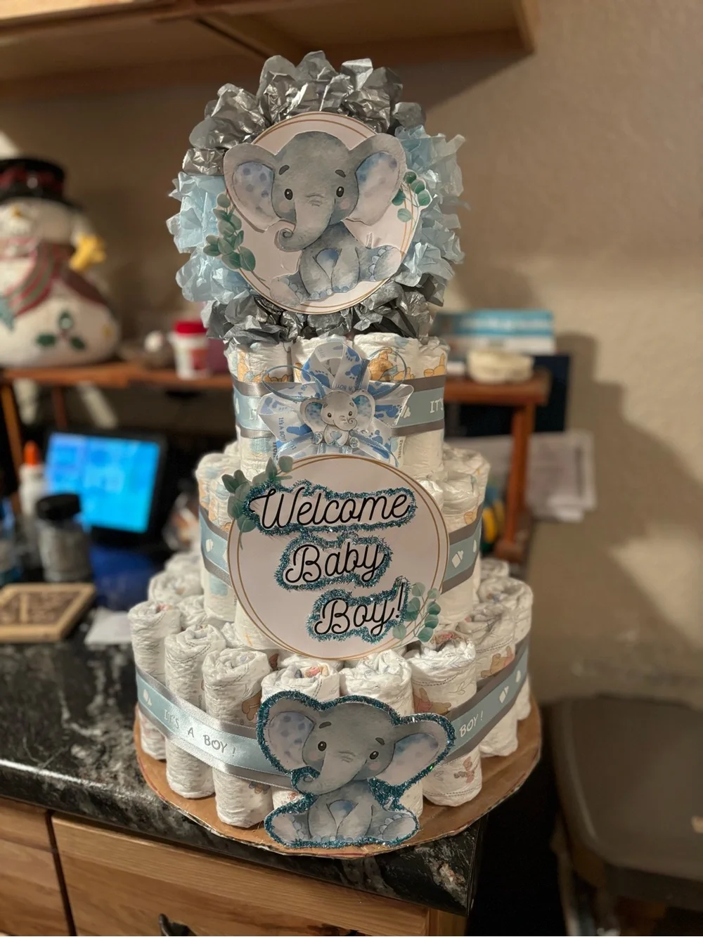 Woodland Baby Shower Diaper Cake with Purple Ribbon and Floral Accents